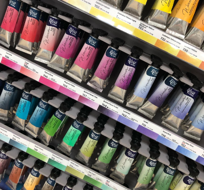 Tubes of artist paint hanging in shop display